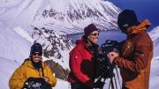 group of people with camera equipment above the fjords in Iceland 